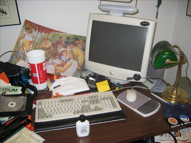 An office desk with no cat on it.
